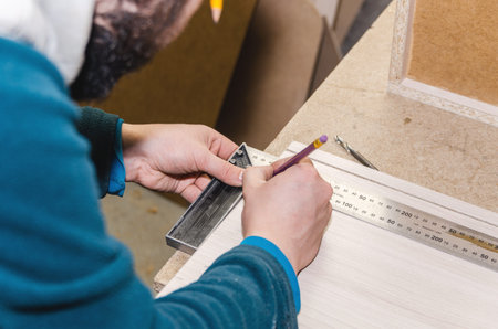 The carpenter processes the blanks for the manufacture of furniture