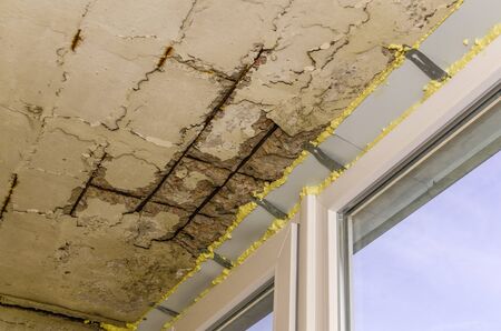 Installation of plastic windows and insulation with polyurethane foam, close-upの写真素材