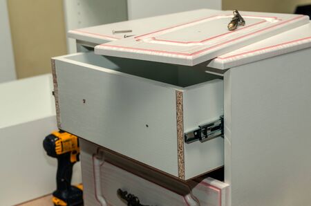 Assembly of hard furniture, close-up drawers for drawersの写真素材