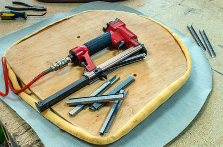 Banner of old worn-out furniture, in the workshop, working process.の写真素材