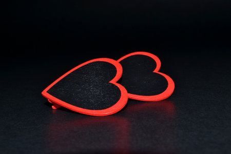 St. Valentine day background. Two heart on a dark backgroundの写真素材