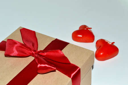 Gift box and aroma candles on white background. Space for textの写真素材