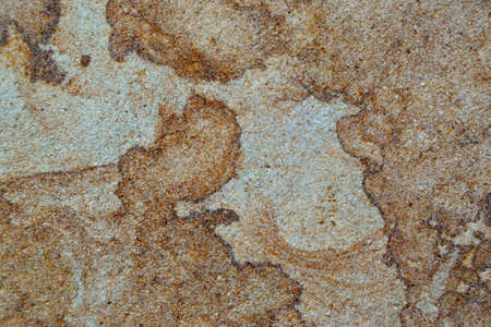 Details of sand stone texture, close up shot of rock surface with vignette at cover and bright spot at center, idea for background or backdrop.の写真素材
