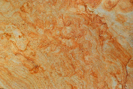 Details of sand stone texture, close up shot of rock surface with vignette at cover and bright spot at center, idea for background or backdrop.の写真素材