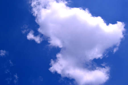 White cloud in the blue sky. Natural background of cloudscapeの写真素材