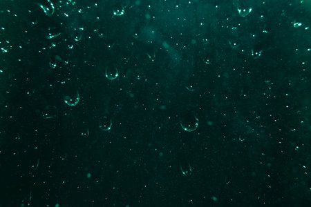 drops of water on dark glass. Abstract background