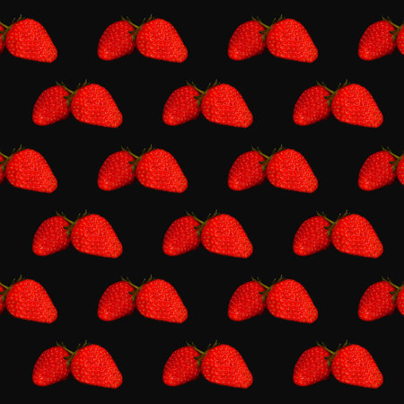 Pattern of fresh strawberries on black background, top view