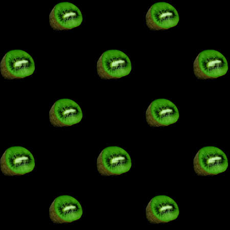 top view of pattern of sliced kiwis on black background for printの写真素材