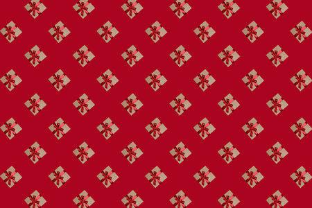 A pattern of gift boxes with a bow made with ribbon isolated on a red background