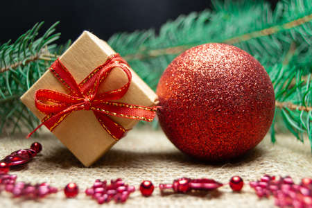 Christmas holidays composition with gift boxes, toys, coniferous tree branch. Happy New Year and Merry Christmas conceptの写真素材