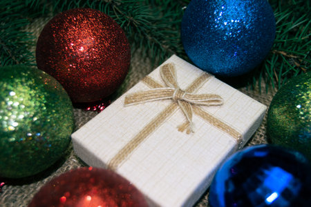 Christmas holidays composition with gift boxes, toys, coniferous tree branch. Happy New Year and...