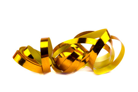 Gold ribbon isolated on a white background, shiny curly christmas decoration . Gifts, golden...