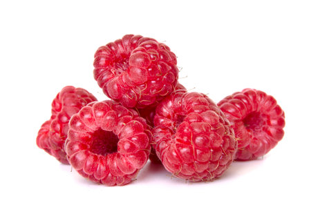 ripe raspberries isolated on white background close upの写真素材