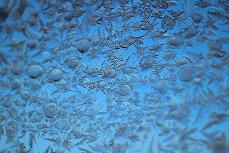 frozen glass with patterns close upの写真素材