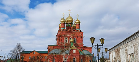 Red brick church with golden domes