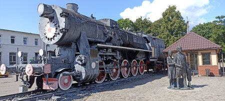 an old steam locomotive standing on the rails