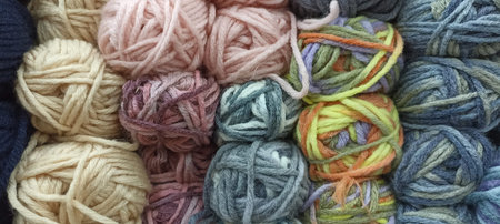 multi-colored skeins of thread folded in a stack close-up. High quality photo