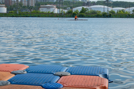 Floating pier made of composite plastic blocks on the river, sea. Plastic bridge on a lake.の写真素材