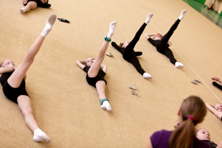 The young gymnast with coachの写真素材