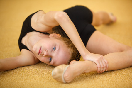 Childrens in sports-young gymnast train your bodyの写真素材