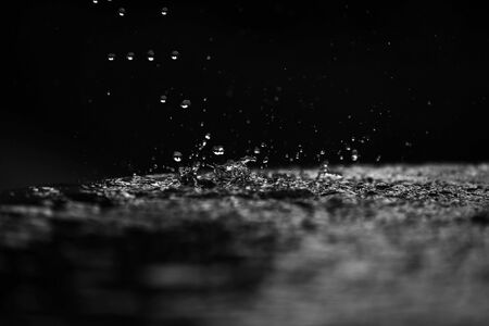 many drops of water close-up in free fallの写真素材