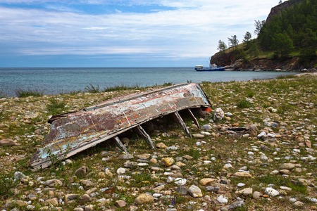 Old boat on the bank of lake Baikal in the east of island Olkhon, about village Uzuryの写真素材