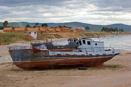 The old ships lay on lakeshore Baikal about settlement Huzhir on island Olkhonの写真素材