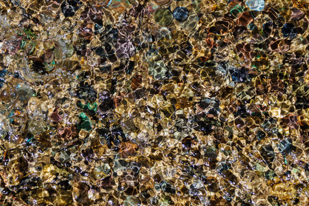 Coins which tourists about falls leave the Maiden tears on road to lake Ritsa in Abkhazia