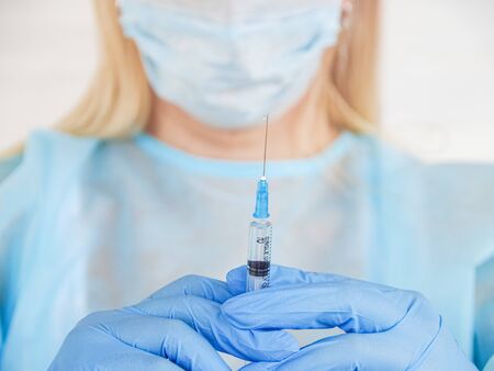 Medicine vaccination. Nurse holds a syring, Health care in hospital conceptの写真素材