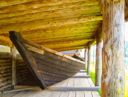 vintage wooden boats under a canopy of round lumber.の写真素材