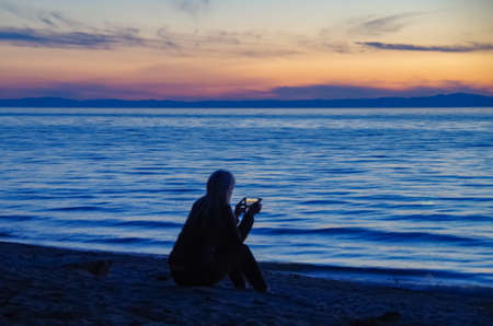 Beautiful sunset on the sandy beach.の写真素材
