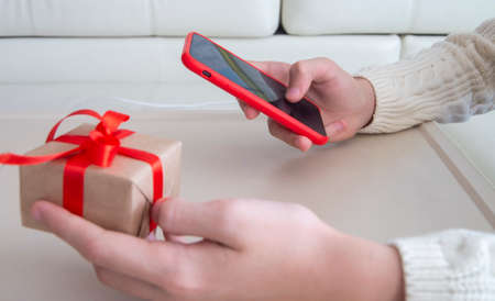 shopping in the online store. Buyer places order from smartphone, holiday sale.の写真素材