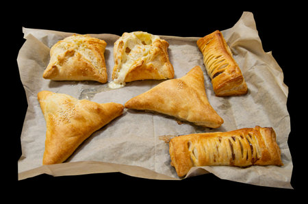Fresh buns with filling and dried spice on a black background ..の写真素材