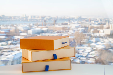 Gift in a yellow box. Three yellow boxes on a natural light background. Horizontally with copy...