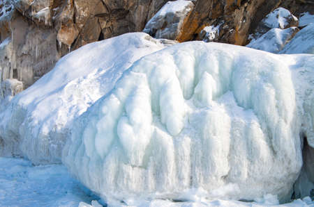 Snow island coast in winter. Winter mountain landscape.の写真素材