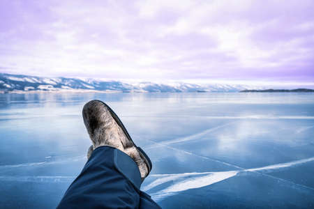 Low section of people standing on the ice.の写真素材