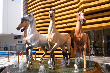 Composition of horses of different colors above the fountain.