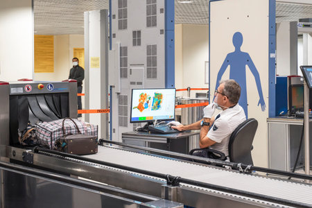 Security gates with metal detectors and scanners at entrance of airport