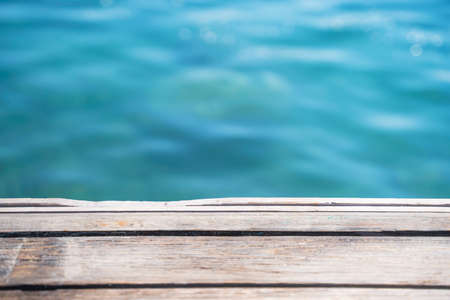 Empty wooden deck with the sea in the background.の写真素材