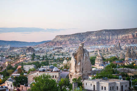 Ancient stone dwellings at sunset in Goreme in Cappadocia, Turkey.の写真素材