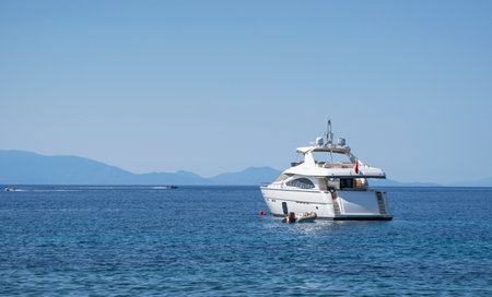 Mens feet in sandals on the beach.の写真素材
