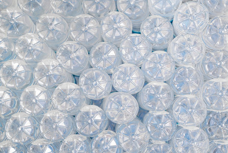 bottom of plastic bottles with water in the refrigerator in a summer cafe.