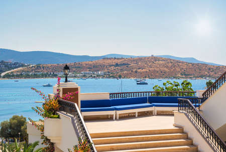 Terrace under the summer sun overlooking the Mediterranean bay.の写真素材