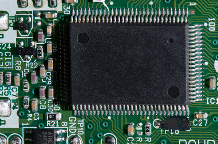 Electric Board with a large black chip with a plurality of thin contacts