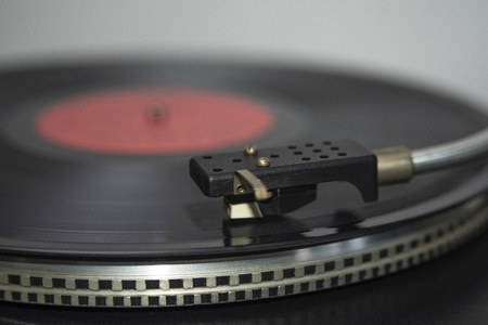Stereo player pickup on blurred background of music vinyl recordの写真素材