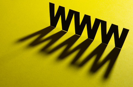 Initial signs request to a web site on a decorative gold backgroundの写真素材