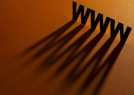 Initial website request signs on a decorative orange backgroundの写真素材