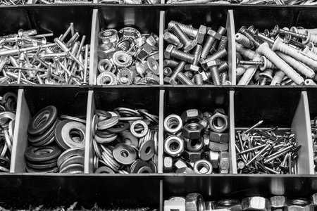 Nuts, bolts and screws in box,bolts and nuts in carton,Assembly kit,close-upの写真素材