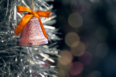 Christmas Tree Decorations: Red Orange Bell, White Snowflake, Shining Silver Tinsel on Green Needles...
