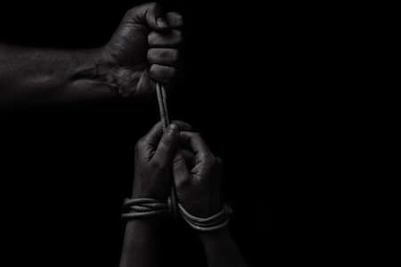 woman hands bound prisoner in room, hands boundの写真素材